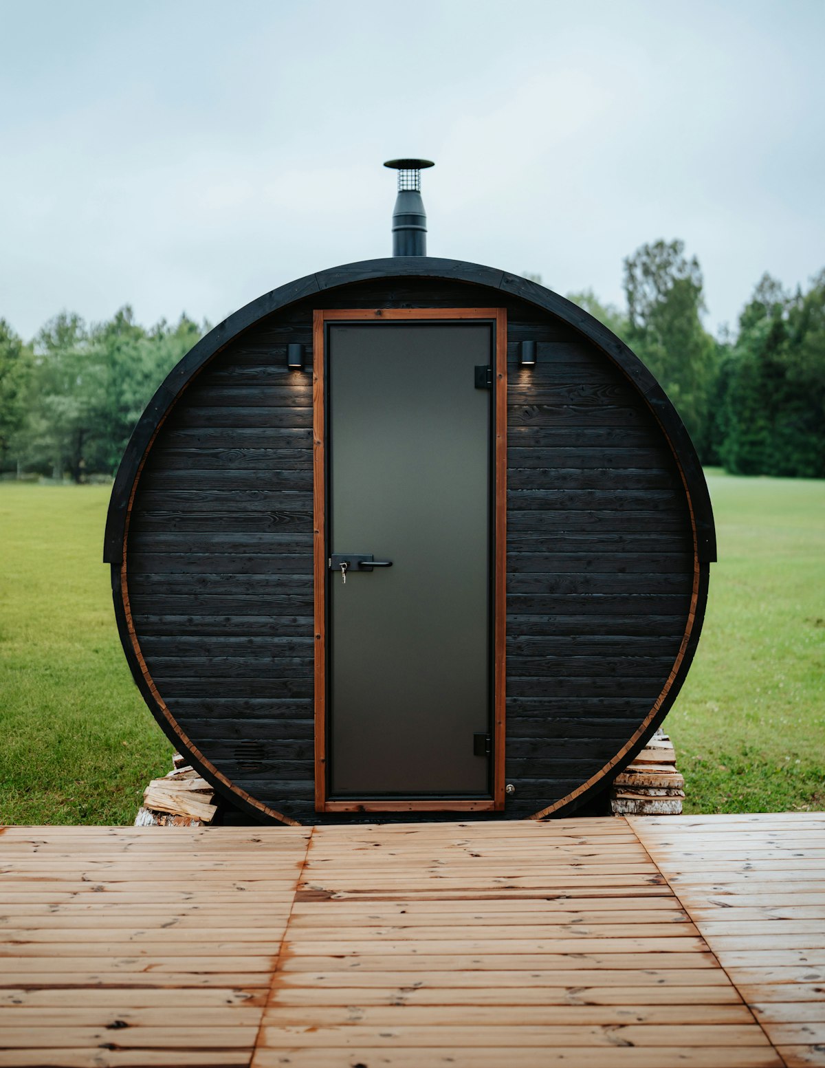 Barrel sauna with chimney outdoors